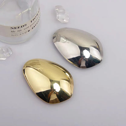 Fermagli per capelli geometrici in metallo color oro lucido a forma di guscio d'uovo